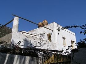 Jars on the roof to catch rainwater in a home in Mexico – Best Places In The World To Retire – International Living